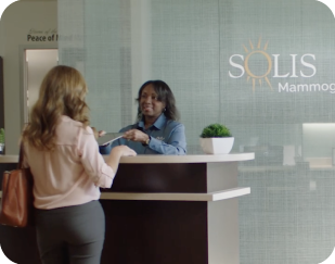 woman walking into Solis Mammography